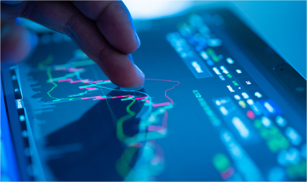 A finger presses a screen, which has graphs and statics on it. 